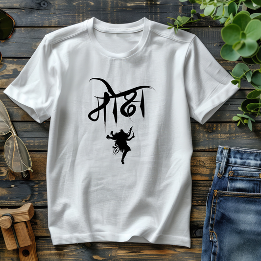 White t-shirt with black graphic design on a wooden surface with jeans and sunglasses.