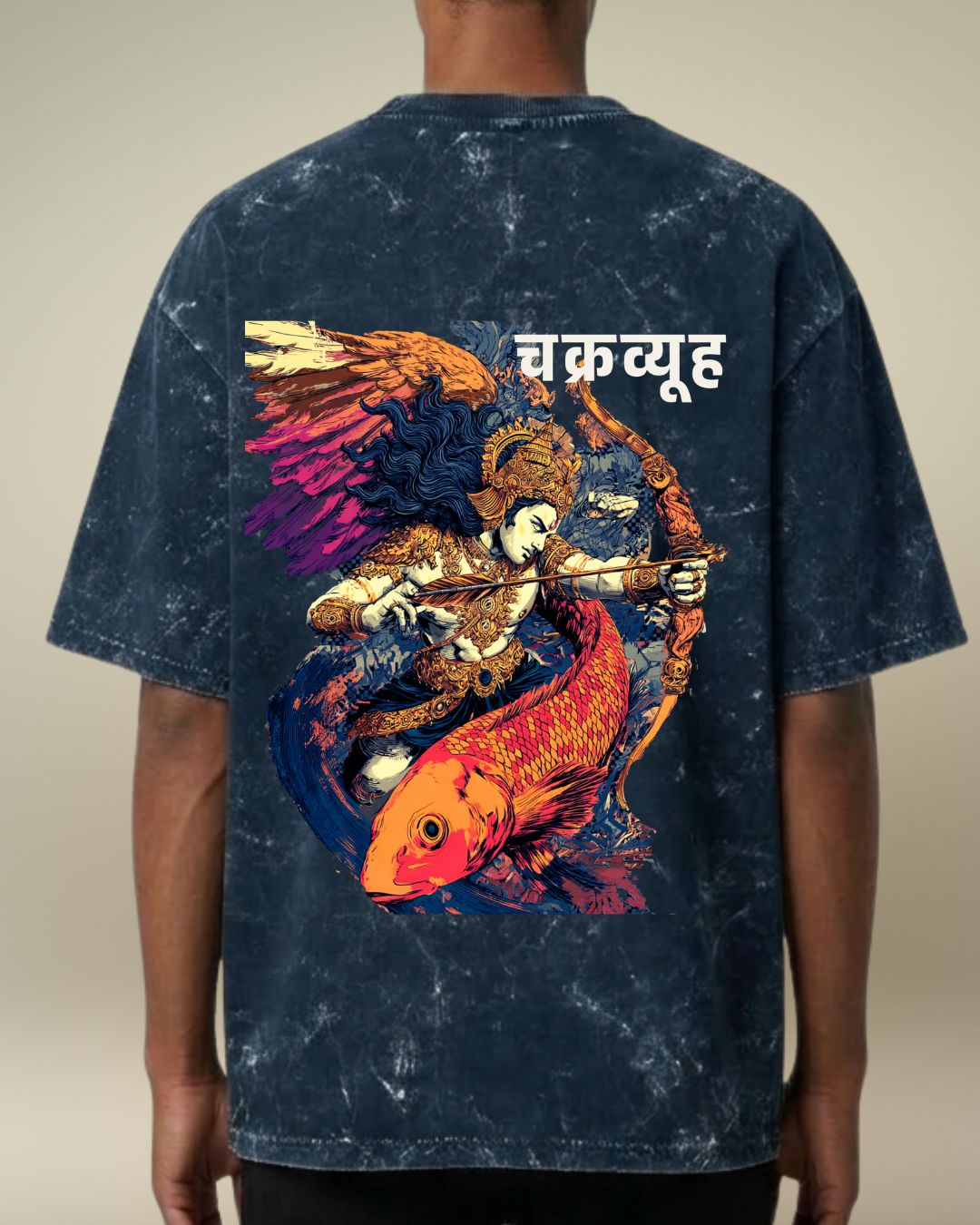 Person wearing a blue tie-dye t-shirt with a colorful graphic design on the back.