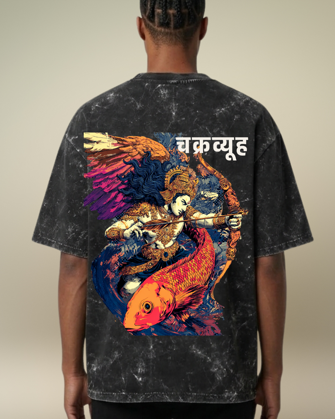Person wearing a black t-shirt with a colorful graphic design on the back