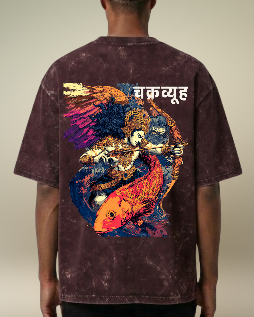 Person wearing a t-shirt with a colorful design on the back