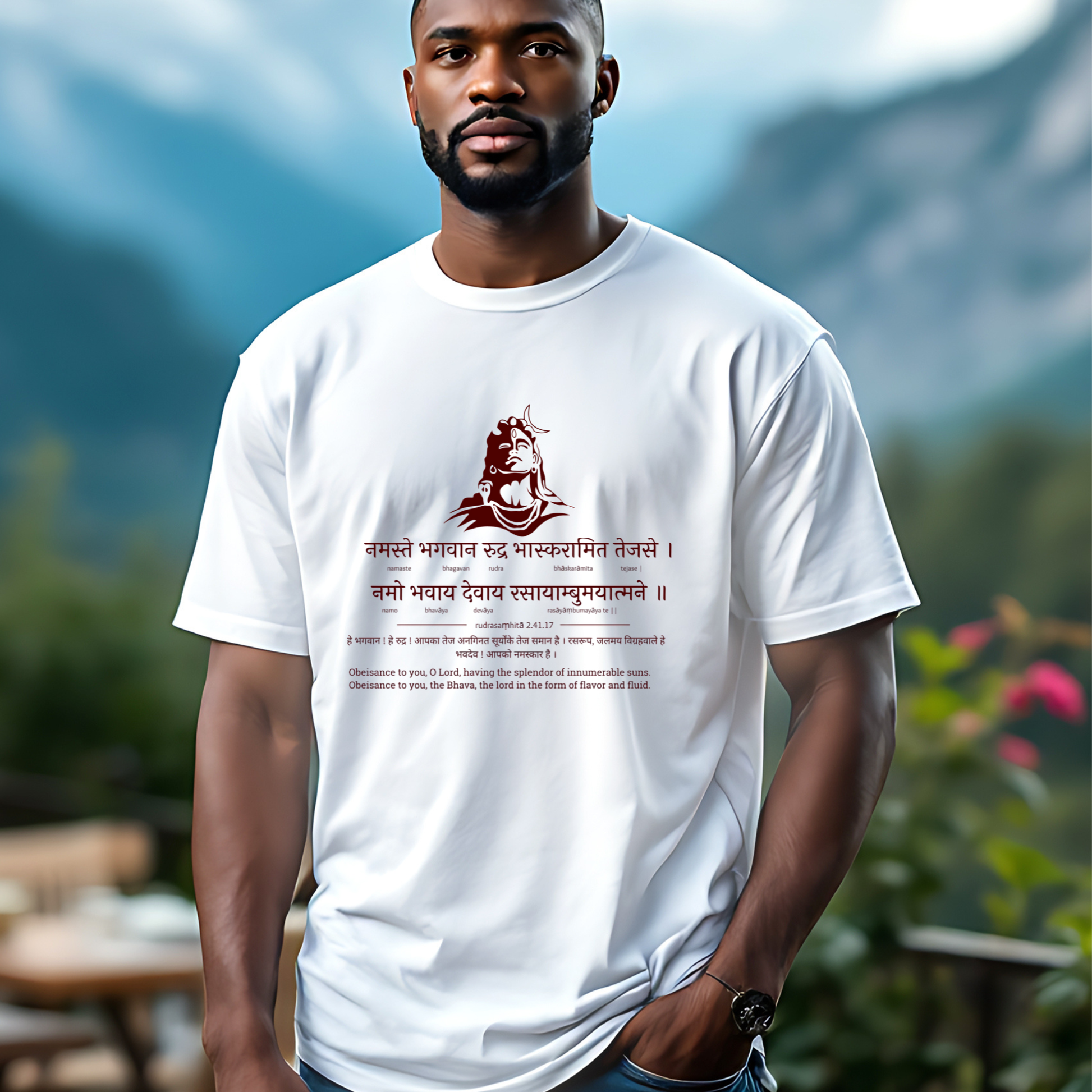 Man wearing a white t-shirt with text and design outdoors