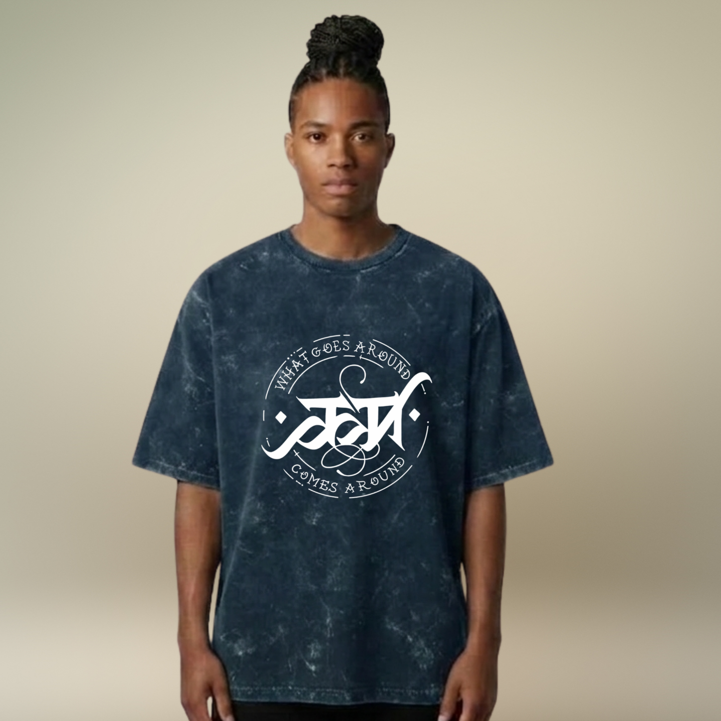 Person wearing a blue tie-dye t-shirt with a white logo and text on a beige background