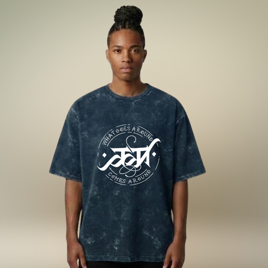 Person wearing a blue tie-dye t-shirt with a white logo and text on a beige background