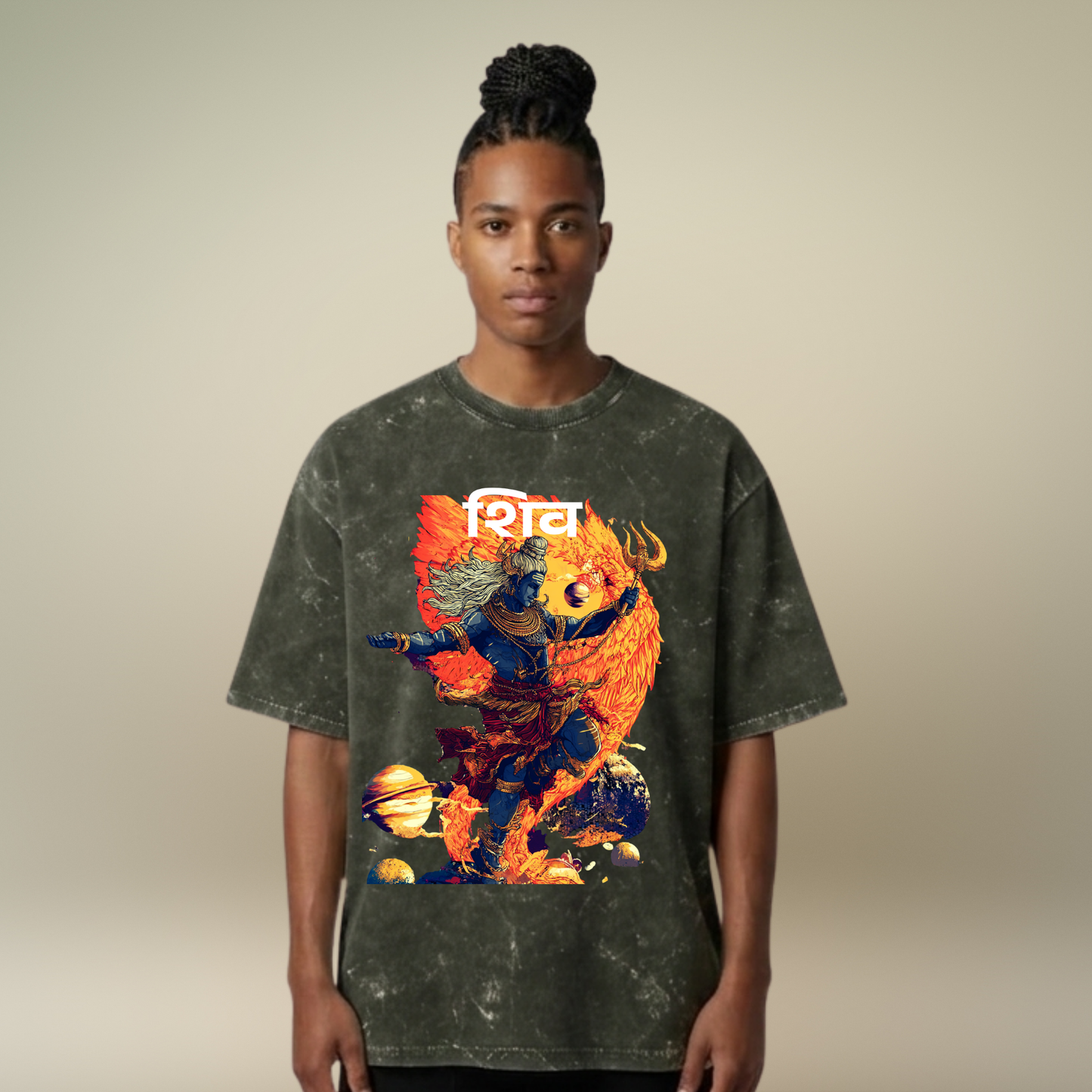 Person wearing a dark gray t-shirt with a colorful graphic design on a beige background