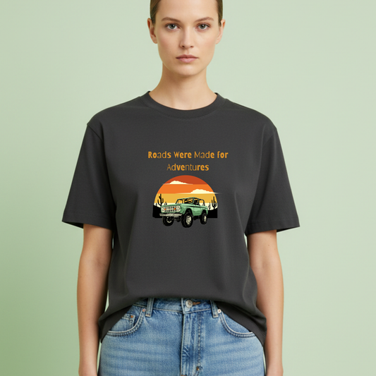 Person wearing a black t-shirt with a graphic design and text on a light green background