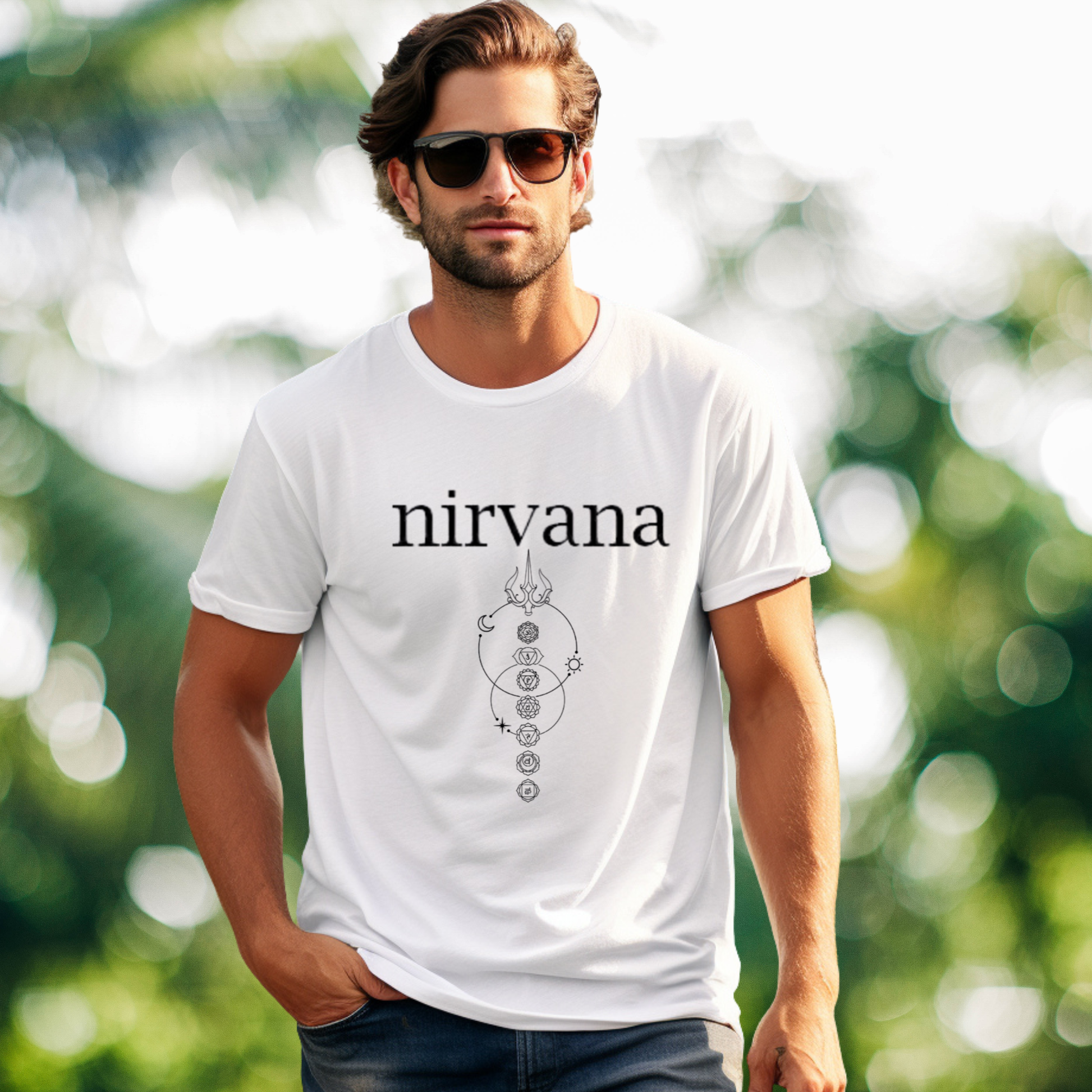 Man wearing a white t-shirt with 'nirvana' design outdoors
