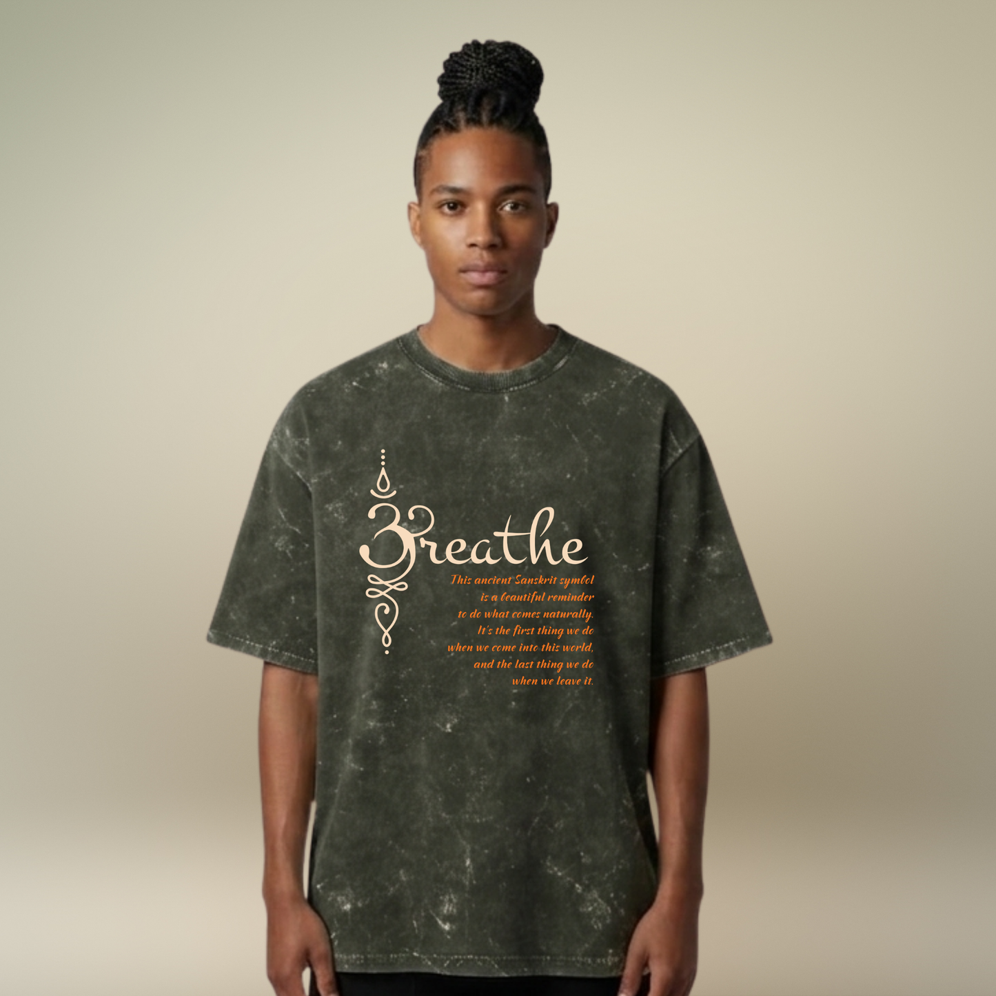 Person wearing a dark green t-shirt with 'Breathe' text on a beige background