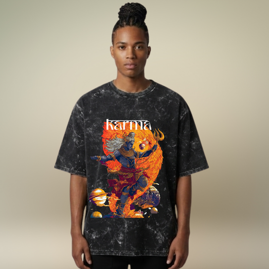 Person wearing a black t-shirt with a colorful graphic and 'Karma' text on a beige background