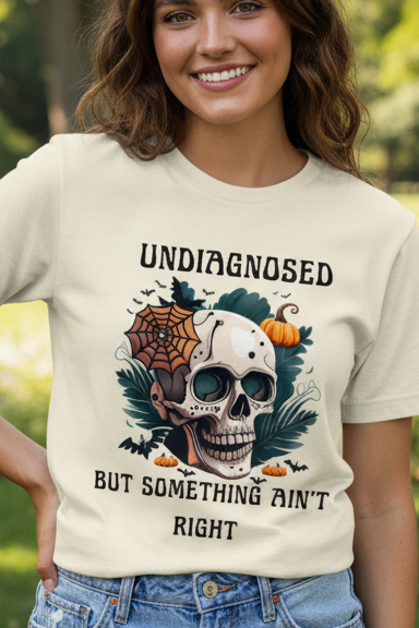 Woman wearing a t-shirt with a skull design and text outdoors