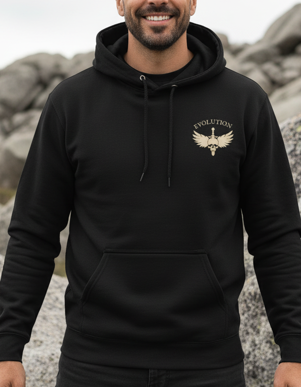 Person wearing a black hoodie with a logo in a rocky outdoor setting