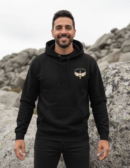 Man wearing a black hoodie with a logo on a rocky background