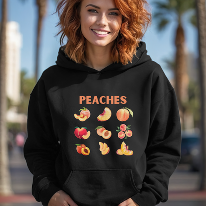 Person wearing a black hoodie with peach graphics and the word 'PEACHES' outdoors.